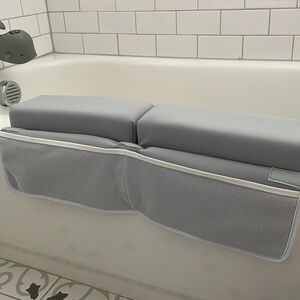 Arm support and toy holder for tub